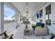 Relaxing porch with water view, comfortable seating, and a TV for entertaining at 1063 Hills Plantation Dr, Charleston, SC 29412