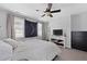 Bright bedroom featuring a ceiling fan, neutral decor, and ample natural light from the large windows at 108 Smith St # 108-I, Charleston, SC 29403