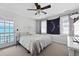 Cozy bedroom with a ceiling fan, natural light from windows, and neutral decor at 108 Smith St # 108-I, Charleston, SC 29403