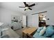 The bedroom features a daybed, a desk, and a glimpse into an ensuite bathroom with a unique vessel sink at 108 Smith St # 108-I, Charleston, SC 29403