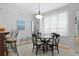 Bright dining area featuring a round table, four chairs, and natural light from the window at 108 Smith St # 108-I, Charleston, SC 29403