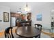 Dining area featuring a round table, dark wood accents, and modern lighting at 108 Smith St # 108-I, Charleston, SC 29403