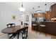 Dining area with breakfast bar, dark wood accents, and stainless steel appliances at 108 Smith St # 108-I, Charleston, SC 29403