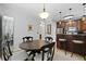 Dining area with a breakfast bar, dark wood accents, and pendant lighting at 108 Smith St # 108-I, Charleston, SC 29403