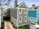 The two-story home showcases a side driveway, neat landscaping, and a classic facade, creating a welcoming appearance at 108 Smith St # 108-I, Charleston, SC 29403
