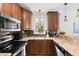 Modern kitchen featuring stainless steel appliances, wood cabinets, and tiled backsplash at 108 Smith St # 108-I, Charleston, SC 29403