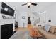 Open living room featuring a fireplace, staircase, and comfortable seating arrangement at 108 Smith St # 108-I, Charleston, SC 29403