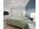 Bright bedroom with ample natural light, a tray ceiling, and soothing blue accent wall at 110 Haverhill St, Summerville, SC 29486