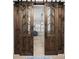 Interior with rustic barn doors featuring glass panels, offering privacy and visual interest at 110 Haverhill St, Summerville, SC 29486