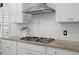Close-up of the kitchen featuring modern cabinetry, stainless steel appliances, and granite countertops at 110 Haverhill St, Summerville, SC 29486