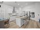 Bright kitchen features stainless steel appliances, granite counters, an island, and stylish bar seating at 110 Haverhill St, Summerville, SC 29486