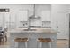 Kitchen island with granite countertops, seating, stainless steel appliances, and modern cabinetry at 110 Haverhill St, Summerville, SC 29486