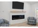 Modern living room showcasing a sleek fireplace, comfortable seating, and abundant natural light at 110 Haverhill St, Summerville, SC 29486