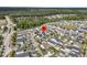 An aerial view of a neighborhood showcasing well-maintained homes and lush landscaping at 113 Sugarberry Way, Summerville, SC 29485