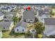 An aerial view of a home with a landscaped backyard, patio area, and detached garage at 113 Sugarberry Way, Summerville, SC 29485