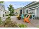 Outdoor patio space with a fire pit, colorful seating, and an outdoor space to enjoy the weather at 113 Sugarberry Way, Summerville, SC 29485