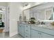 Gorgeous bathroom with double sinks, granite countertop, ample lighting and framed mirror at 113 Sugarberry Way, Summerville, SC 29485