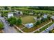 A lush community green with a blue-and-white building surrounded by landscaping and walking paths at 113 Sugarberry Way, Summerville, SC 29485