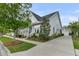 Charming two-story home with a covered porch, landscaped yard, and driveway at 113 Sugarberry Way, Summerville, SC 29485