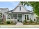 Charming cottage-style home with inviting front porch and beautifully landscaped front yard at 113 Sugarberry Way, Summerville, SC 29485