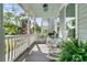 Inviting front porch with rocking chairs, stylish decor, and a relaxing outdoor ambiance at 113 Sugarberry Way, Summerville, SC 29485