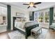 Sunlit main bedroom with hardwood floors, neutral decor, and a view of the outdoors at 113 Sugarberry Way, Summerville, SC 29485