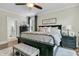 Beautiful bedroom featuring dark wood furniture, neutral walls, ceiling fan and lots of natural light at 113 Sugarberry Way, Summerville, SC 29485