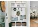 Charming mudroom features storage cubbies, bench seating and decorative accents at 113 Sugarberry Way, Summerville, SC 29485