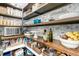 Spacious walk-in pantry with wooden shelves stocked with food and kitchen essentials at 113 Sugarberry Way, Summerville, SC 29485