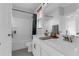 Bright bathroom featuring double sinks, white cabinetry, and a shower-tub combination with a shower curtain at 1130 5Th Ave, Charleston, SC 29407