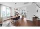 Bright dining area with hardwood floors, modern lighting, and an open view to the kitchen at 1130 5Th Ave, Charleston, SC 29407