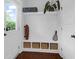 Bright entryway featuring built-in shelving, decorative items, and a view of the outdoors through a glass-paneled door at 1130 5Th Ave, Charleston, SC 29407