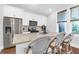 Modern kitchen with island, granite countertops, stainless steel appliances, and wood flooring at 1130 5Th Ave, Charleston, SC 29407
