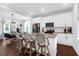 Spacious kitchen featuring an island with bar seating, open to living room at 1130 5Th Ave, Charleston, SC 29407