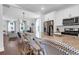 Well-equipped kitchen featuring granite countertops, stainless steel appliances, and seamless flow into the open living area at 1130 5Th Ave, Charleston, SC 29407