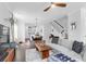 Open-concept living room with hardwood floors and a modern kitchen, creating a welcoming space at 1130 5Th Ave, Charleston, SC 29407