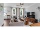Cozy living room with modern furnishings and bright windows showcasing the home's natural light at 1130 5Th Ave, Charleston, SC 29407