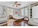 Inviting Bedroom features a crib, hardwood floors, and natural light, creating a comfortable setting at 1157 King St, Charleston, SC 29403
