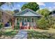 Charming craftsman home with a welcoming front porch and lush landscaping at 1157 King St, Charleston, SC 29403