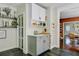 Beautiful kitchen area featuring modern countertops, cabinets and hardwood floors at 1157 King St, Charleston, SC 29403