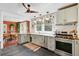 Modern kitchen area showcasing stainless steel appliances and an open floor plan at 1157 King St, Charleston, SC 29403