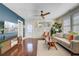 Stylish living room showcasing hardwood floors, TV, and comfortable seating at 1157 King St, Charleston, SC 29403