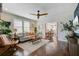Bright living room featuring hardwood floors, modern furnishings, and an open layout at 1157 King St, Charleston, SC 29403