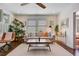 Inviting living room with neutral decor, hardwood floors, and ample natural light at 1157 King St, Charleston, SC 29403