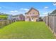 Expansive backyard with lush green grass, fully fenced for privacy at 120 Indigo Marsh Cir, Wando, SC 29492