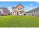A well-maintained backyard with green grass, providing ample space for outdoor activities at 120 Indigo Marsh Cir, Wando, SC 29492