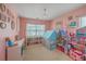 Playful pink ' room features a large window and space for toys and imaginative play at 120 Indigo Marsh Cir, Wando, SC 29492