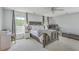 Serene bedroom with a large bed, neutral tones, and natural light, creating a relaxing retreat at 120 Indigo Marsh Cir, Wando, SC 29492