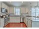 Contemporary kitchen featuring stainless steel appliances, granite countertops, and stylish cabinetry at 120 Indigo Marsh Cir, Wando, SC 29492