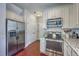 Updated kitchen boasts stainless steel appliances and granite countertops with ample cabinet space at 120 Indigo Marsh Cir, Wando, SC 29492